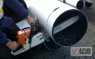 Cutting Poly Pipe with Chainsaw 